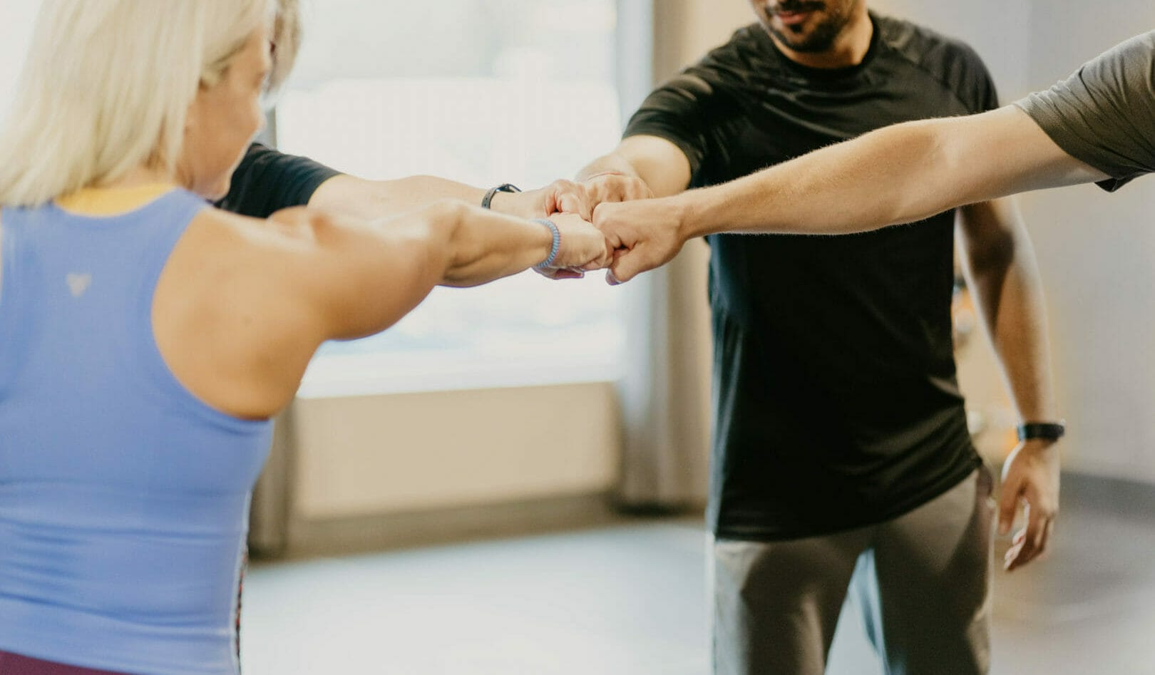 small group calls doing a high 5 after class at CrossFit Durst in Brantford