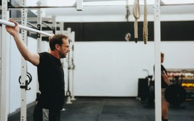 Man stretching with bar